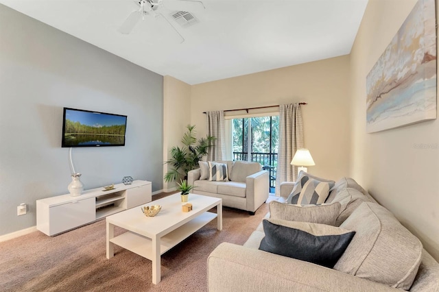 carpeted living room featuring ceiling fan