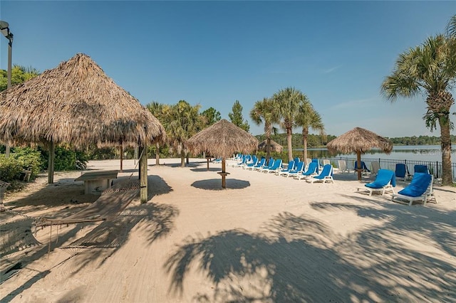 view of community featuring a water view and a gazebo