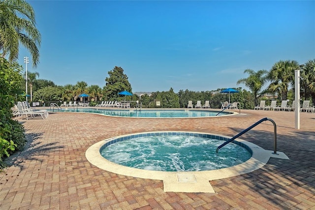 view of pool featuring a community hot tub