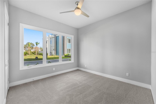 carpeted empty room with ceiling fan