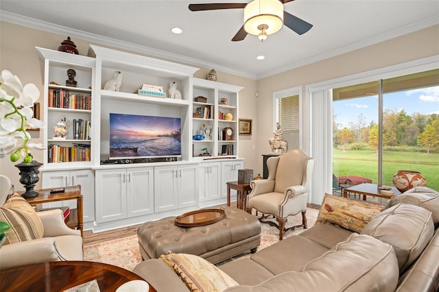 living room with ceiling fan, crown molding, and light hardwood / wood-style flooring