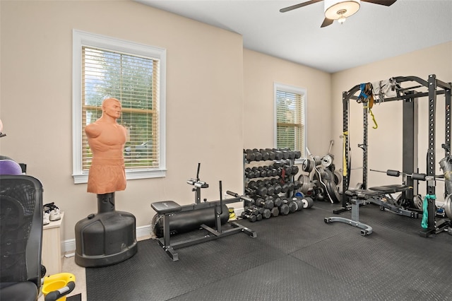 exercise room with ceiling fan and a healthy amount of sunlight