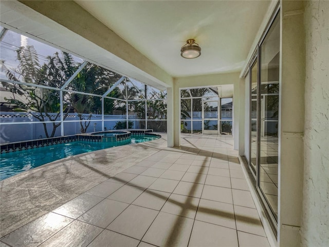 view of swimming pool featuring a lanai, an in ground hot tub, and a patio