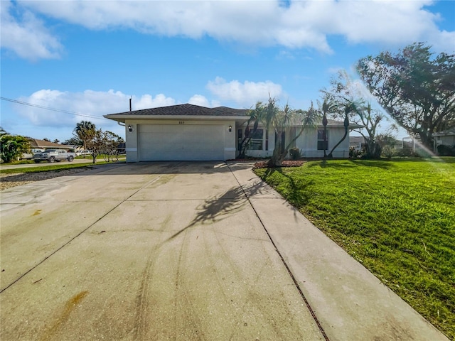 ranch-style home featuring a garage and a front lawn