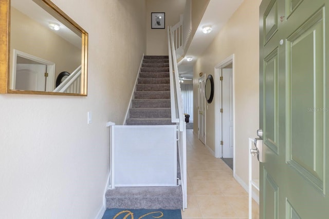 stairway with tile patterned flooring