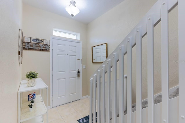 foyer entrance featuring light tile patterned floors