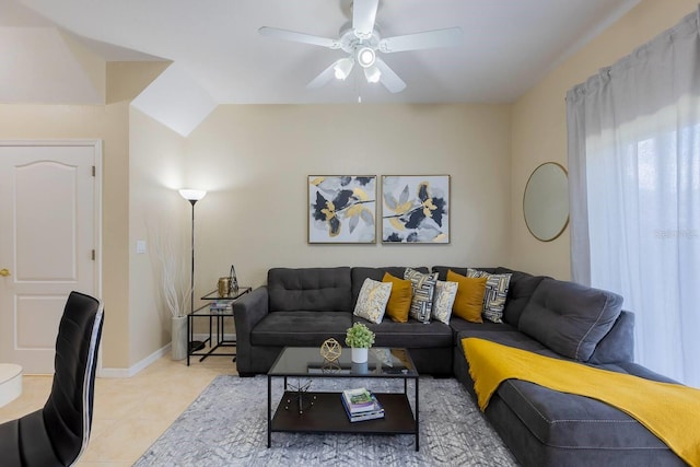 living room featuring ceiling fan and light tile patterned floors