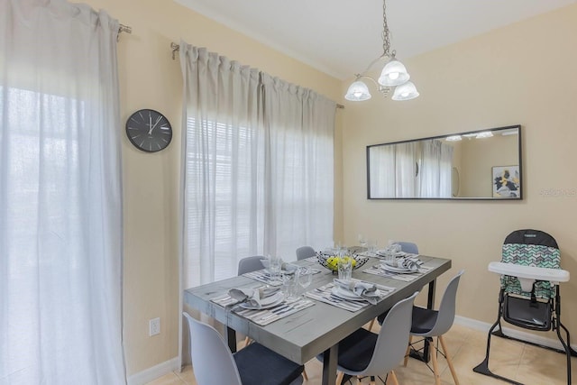 dining area featuring an inviting chandelier and light tile patterned flooring