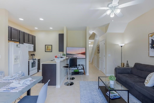 tiled living room featuring ceiling fan