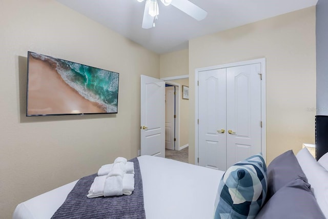 bedroom featuring ceiling fan and a closet