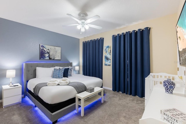 bedroom with ceiling fan and carpet floors