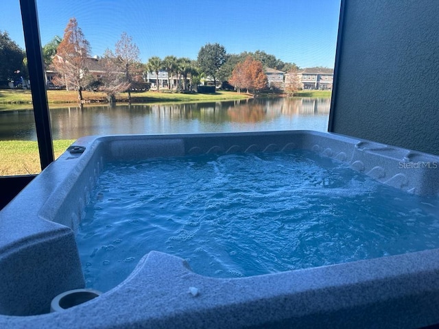 view of pool with a water view