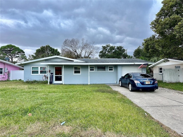 single story home with a front lawn