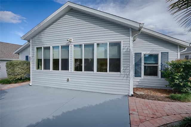 view of property exterior featuring a patio