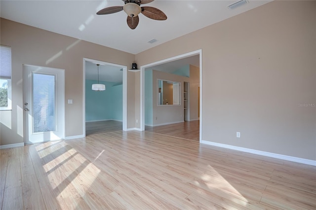 unfurnished room with ceiling fan and light hardwood / wood-style floors