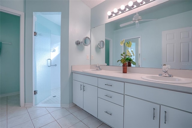 bathroom featuring vanity, tile patterned floors, ceiling fan, and walk in shower