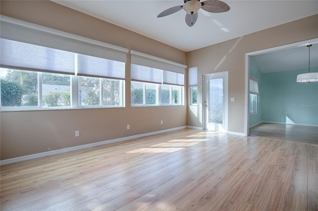 spare room featuring ceiling fan and light hardwood / wood-style flooring