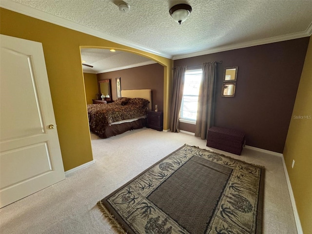 bedroom with carpet floors, crown molding, and baseboards