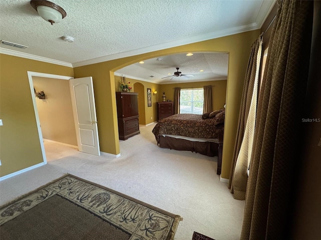 carpeted bedroom with arched walkways, visible vents, ornamental molding, a textured ceiling, and baseboards