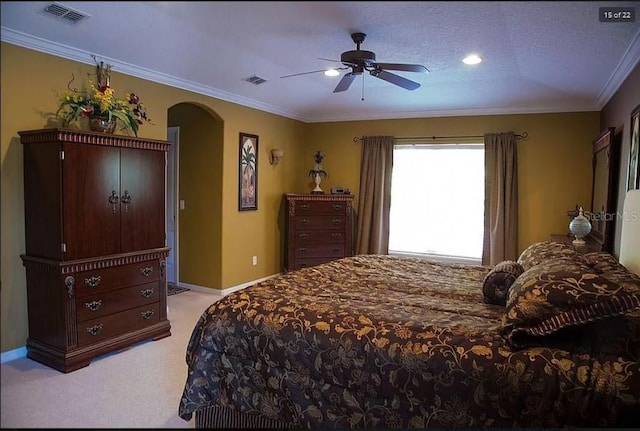 bedroom featuring arched walkways, light carpet, visible vents, baseboards, and crown molding