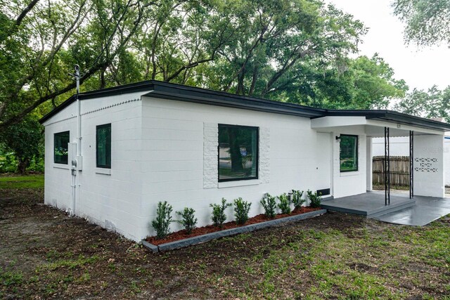 view of front facade with concrete block siding
