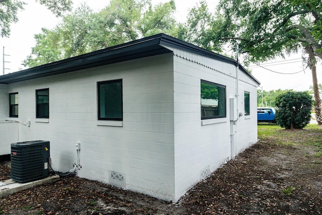 view of side of property featuring central AC unit