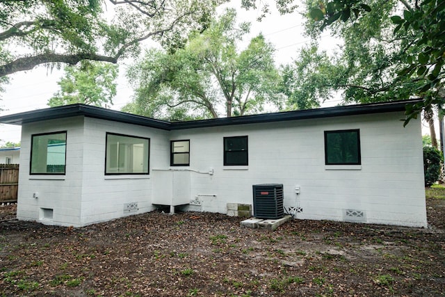 rear view of property with central air condition unit