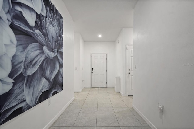 corridor featuring light tile patterned floors