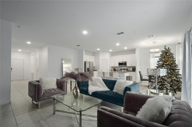 living room with light tile patterned floors