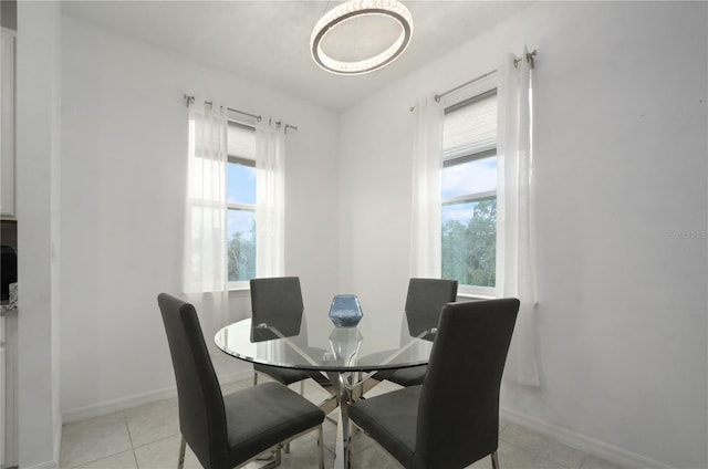 tiled dining area featuring plenty of natural light