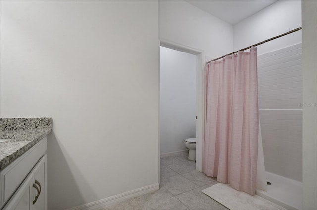 bathroom featuring tile patterned flooring, vanity, toilet, and a shower with curtain