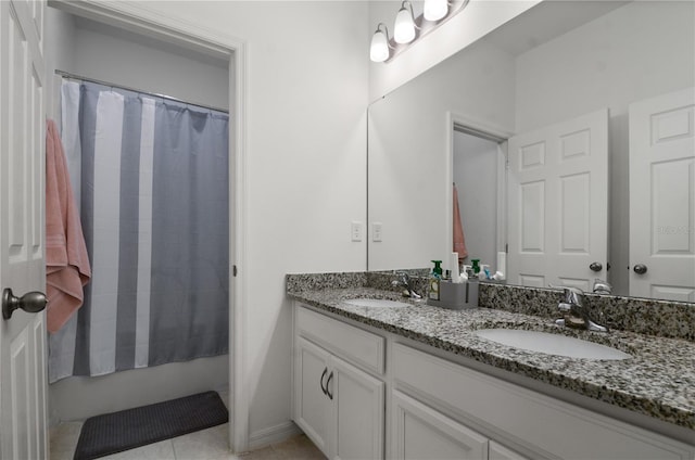 bathroom with vanity, tile patterned floors, and shower / tub combo with curtain