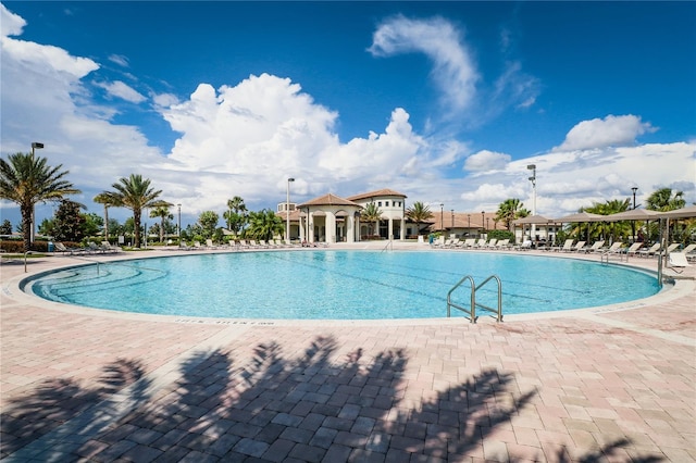 view of swimming pool with a patio