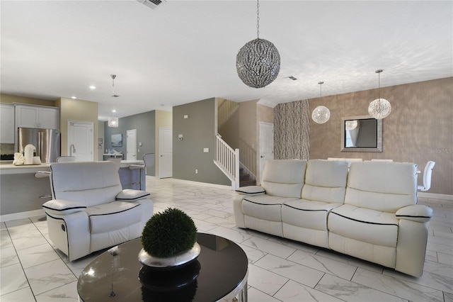 living room featuring a chandelier