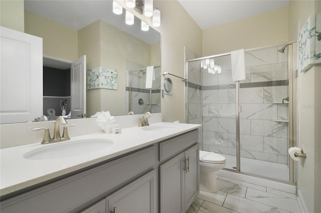 bathroom featuring walk in shower, vanity, and toilet