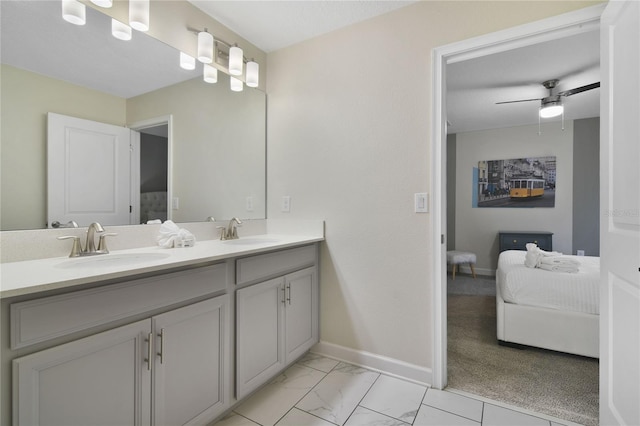 bathroom featuring ceiling fan and vanity