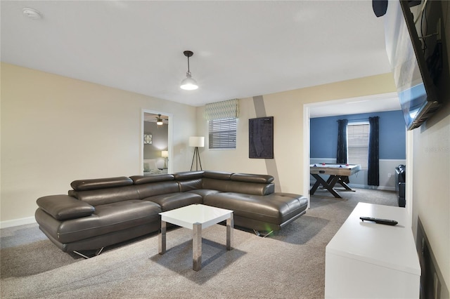 living room featuring ceiling fan and carpet flooring