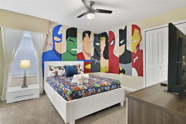 bedroom featuring a closet, ceiling fan, and carpet flooring