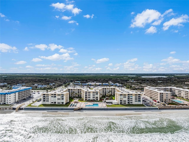 bird's eye view featuring a view of the beach and a water view