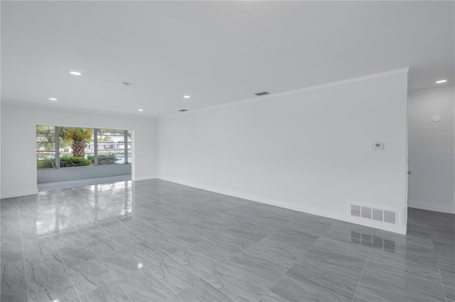 tiled spare room with crown molding