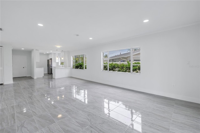 unfurnished living room with light tile floors