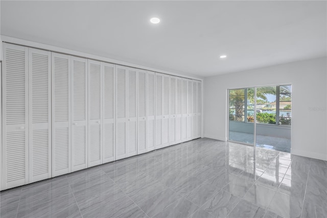 spare room featuring light tile floors