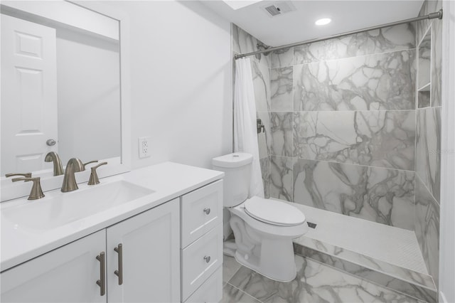 bathroom featuring walk in shower, tile flooring, vanity, and toilet