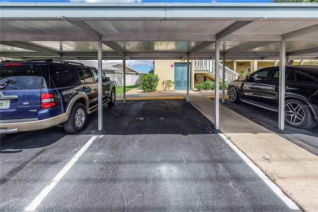 view of parking / parking lot with a carport