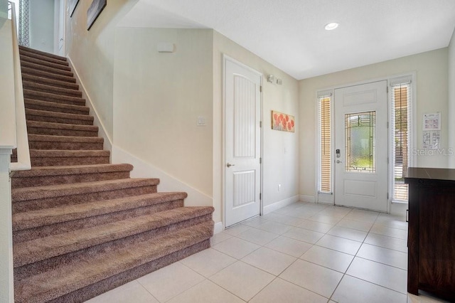 foyer featuring light tile patterned floors