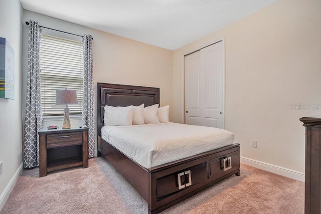 carpeted bedroom featuring a closet