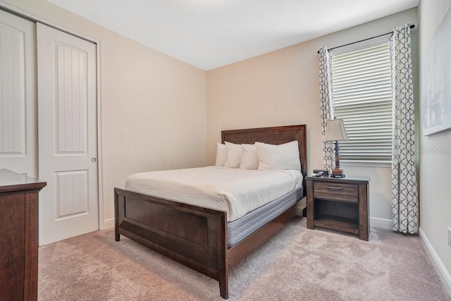 carpeted bedroom featuring a closet