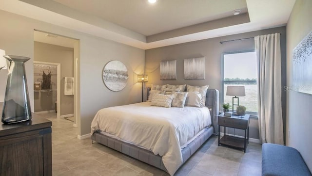 bedroom with a raised ceiling