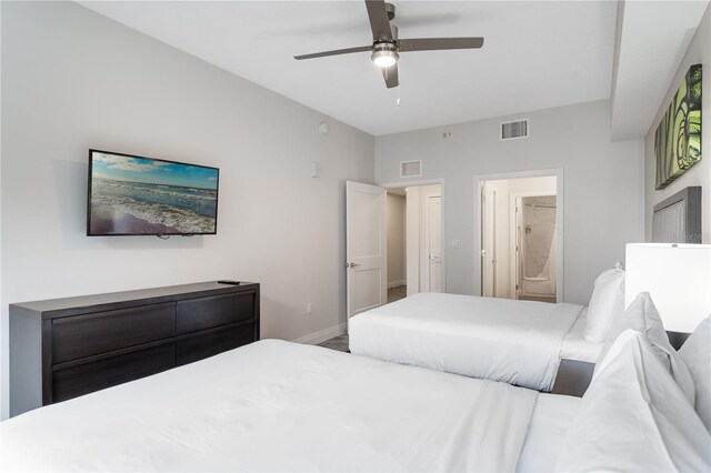 bedroom featuring ensuite bath and ceiling fan