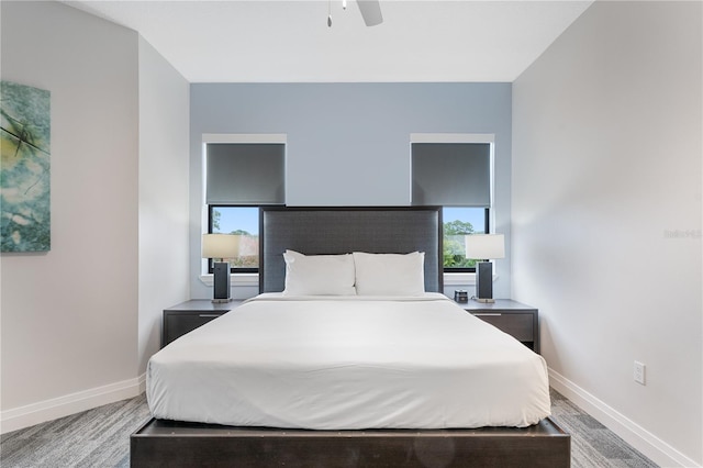 bedroom with ceiling fan and carpet floors